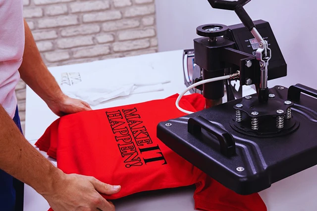 Red T-Shirt Under Machine for Custom Merchandise Printing