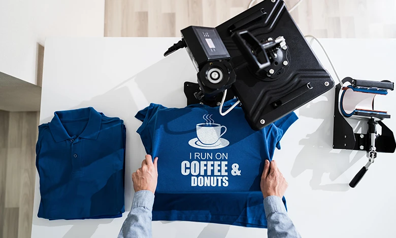 Person Inspecting Blue T-shirt with Sublimation Print Design
